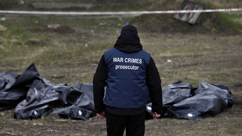 ARCHIV - Nach dem Abzug der russischen Truppen entdeckten die Behörden Hunderte Leichen in Butscha. Foto: Carol Guzy/ZUMA Press Wire/dpa