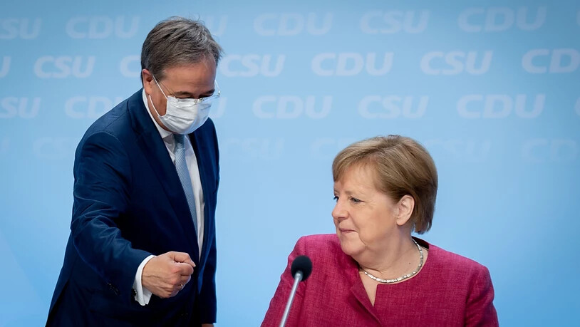 Die deutsche Bundeskanzlerin Angela Merkel und ihr möglicher Nachfolger Armin Laschet. Foto: Kay Nietfeld/dpa