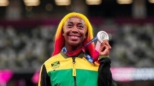Nicht zu übersehen: Shally-Ann Fraser Price sorgt für einen olympischen Farbtupfer mit ihren Haaren. 